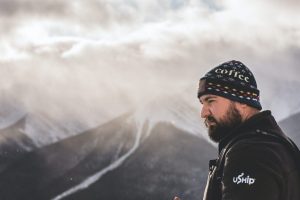 shallow focus photo of man wearing black knit cap