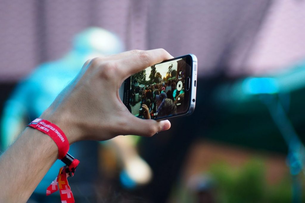 person using black smartphone