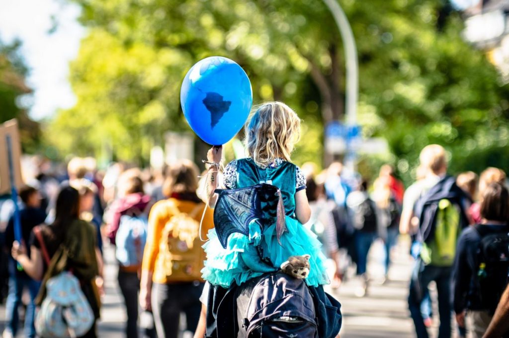 girl holding balloon