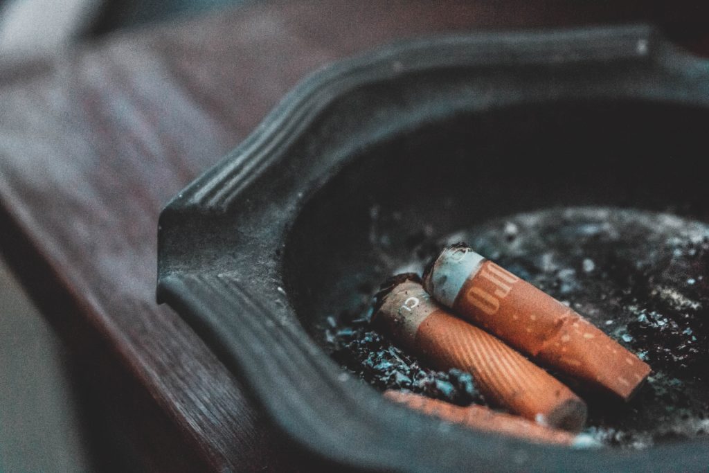 three cigarette butts on ashtray