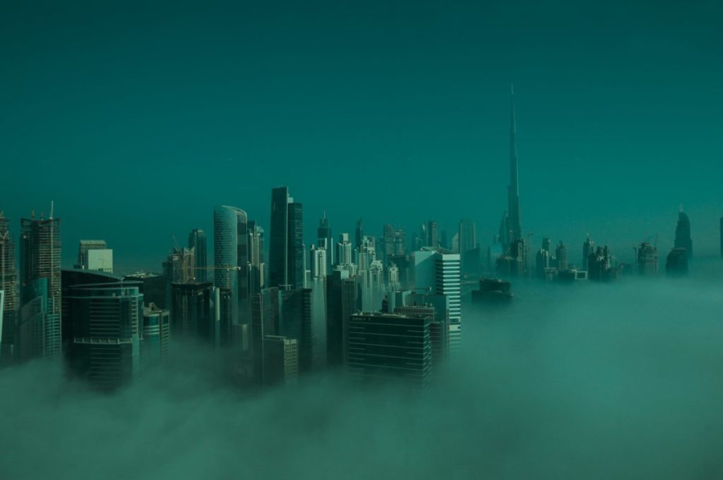 city skyline under blue sky during daytime