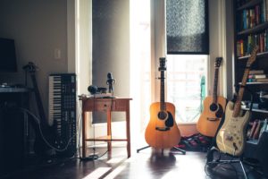 several guitars beside of side table