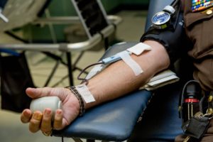 person on chair donating blood