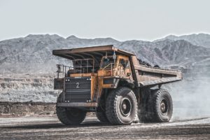 yellow and black heavy equipment on snow covered ground during daytime