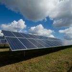 solar panels on green field